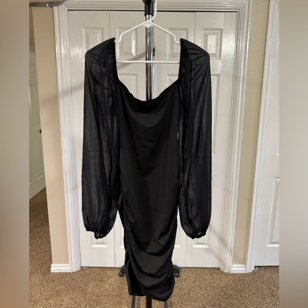 Elegant Black Dress with Sheer Sleeves